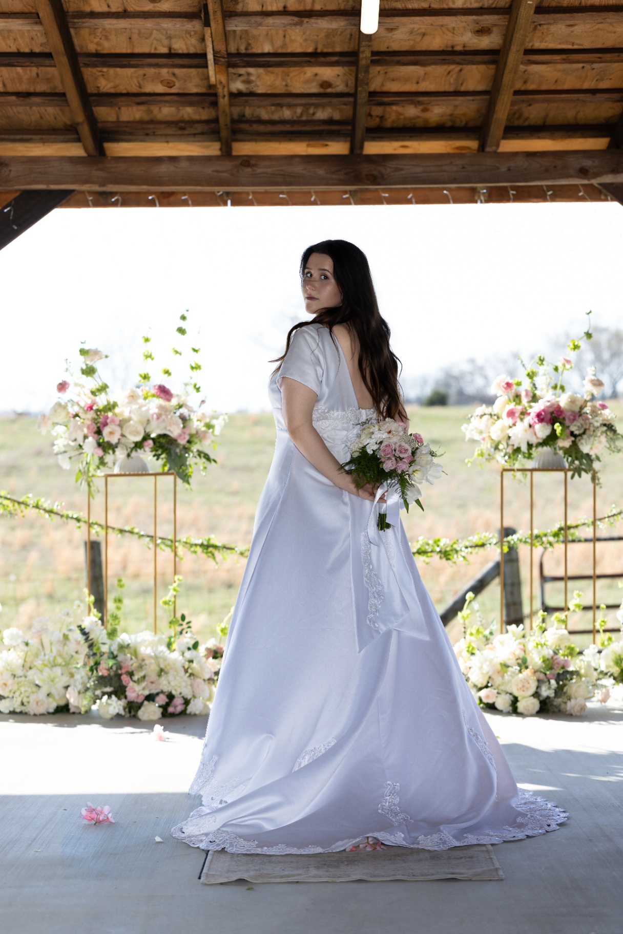 Bride with bouquet at the L & D Farms pavilion ceremony space