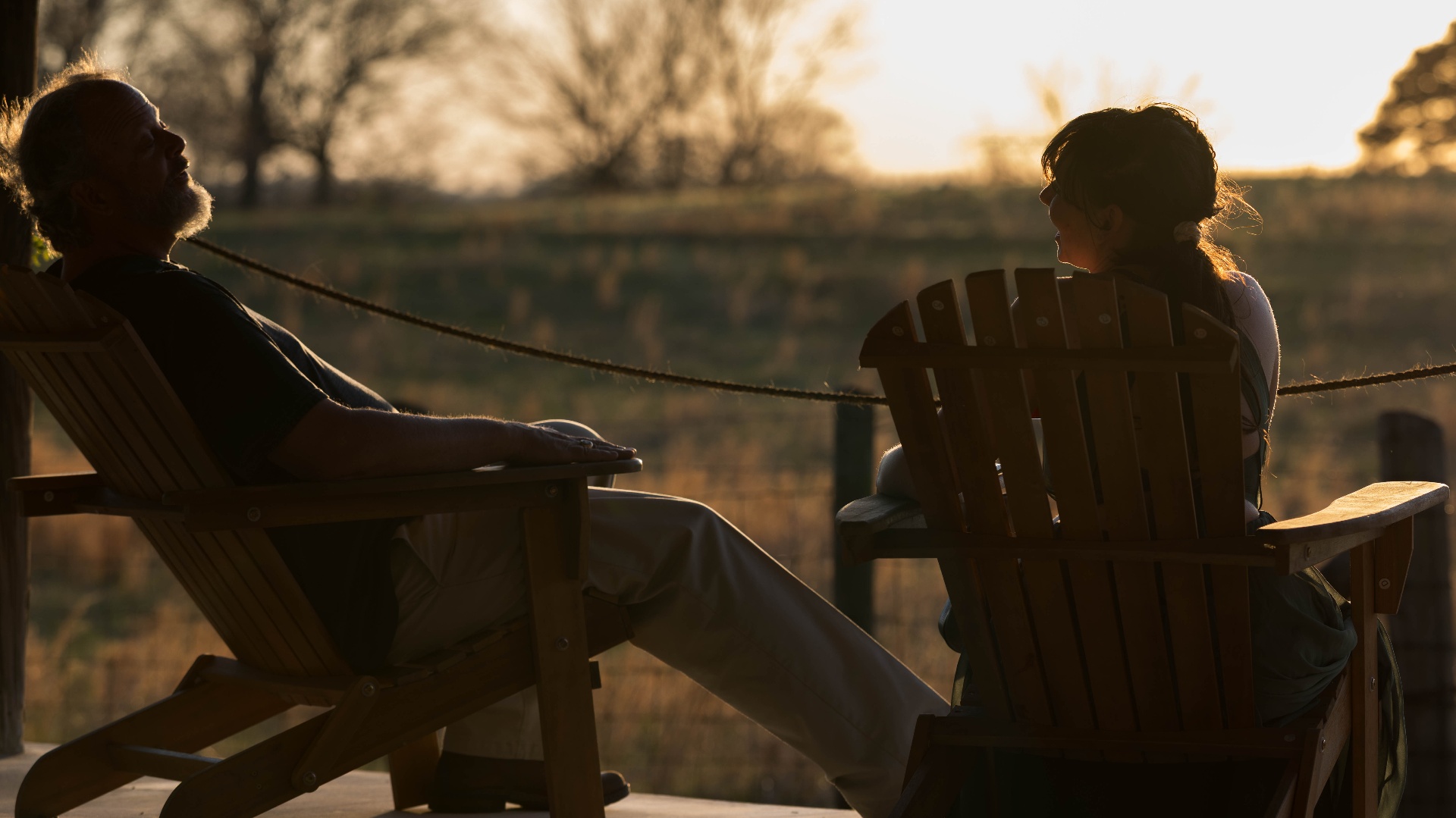 Golden hour porch conversation overlooking the fields at L & D Farms