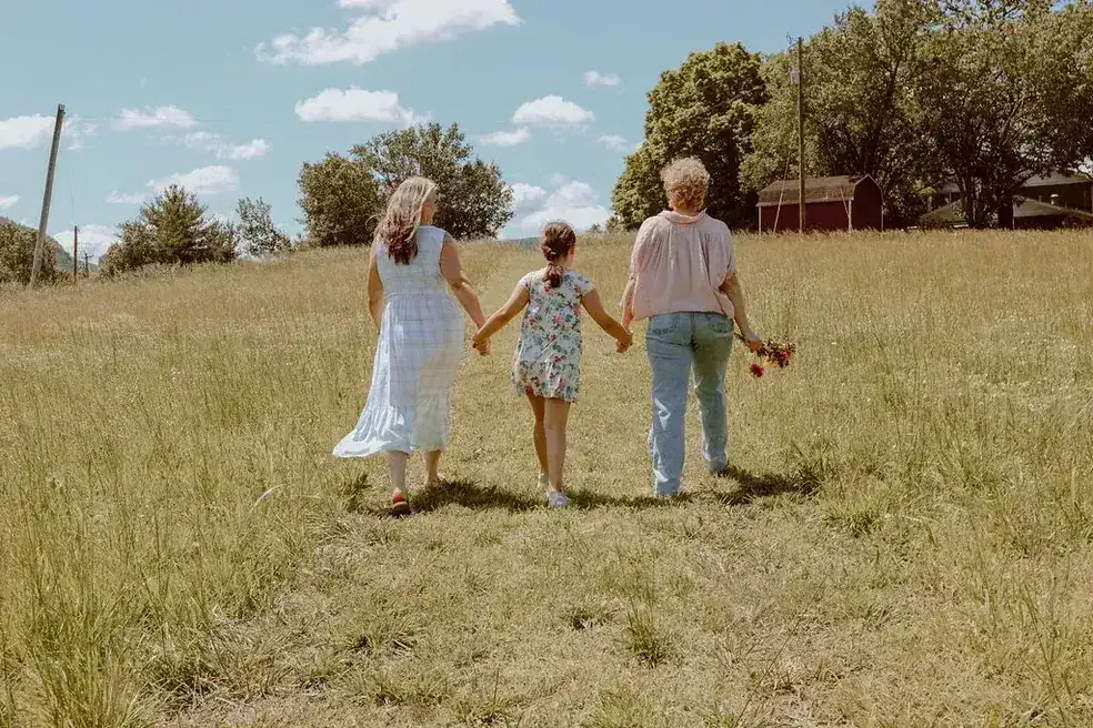 Family walking through the meadow at L & D Farms in Ooltewah, TN